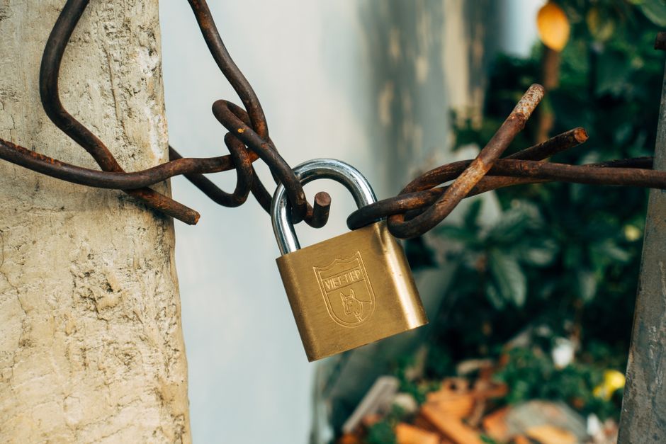 A glowing padlock icon overlaying a stream of network data.